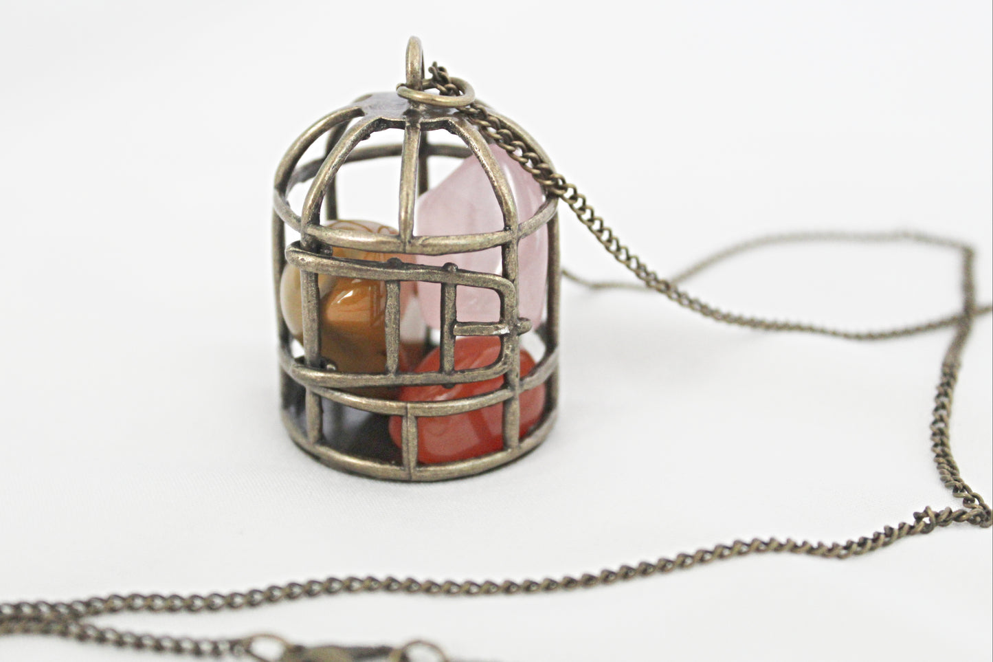 Birdcage Crystal Necklace featuring Mookaite, Rose Quartz, and Carnelian