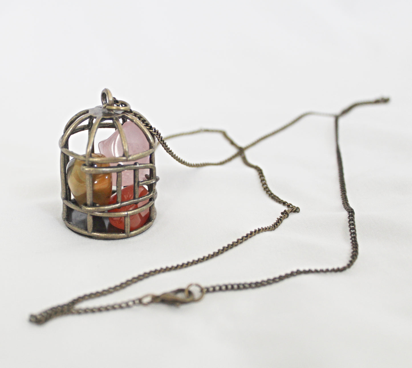 Birdcage Crystal Necklace featuring Mookaite, Rose Quartz, and Carnelian