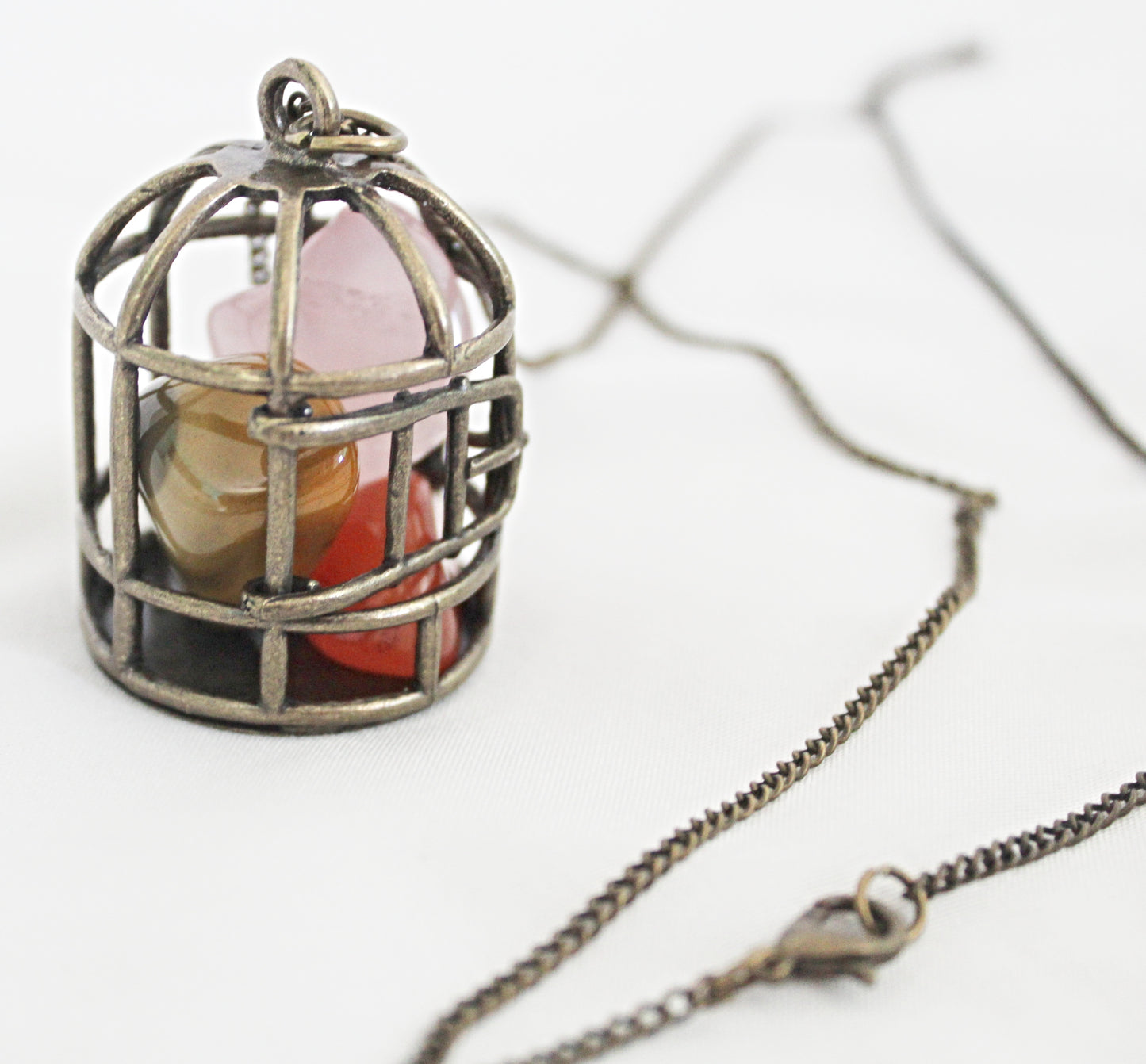 Birdcage Crystal Necklace featuring Mookaite, Rose Quartz, and Carnelian