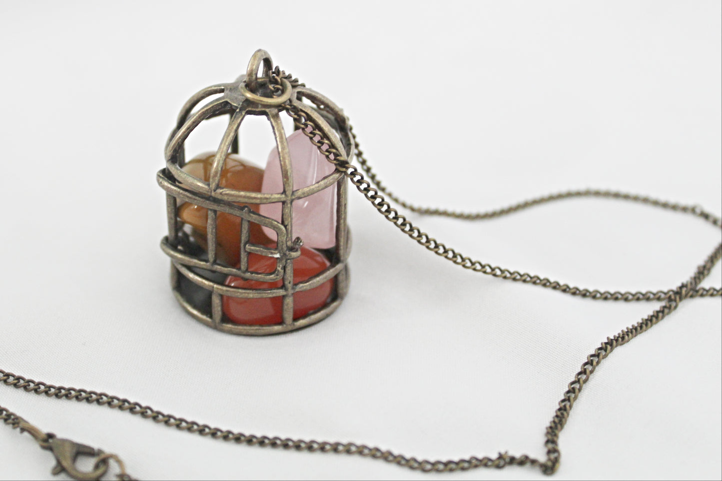 Birdcage Crystal Necklace featuring Mookaite, Rose Quartz, and Carnelian